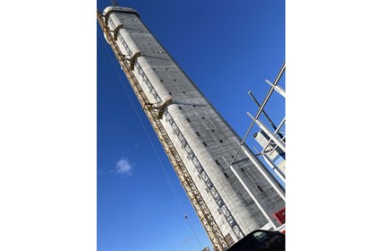 Concrete is poured into a mold that is slowly raised using hydraulic jacks. The tower has grown by 2.5 meters every day since work started in July 2024.